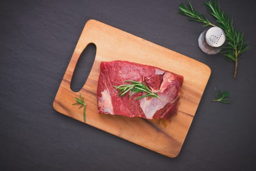 Raw beef meat on a cutting board
