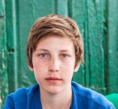 outdoor portrait of happy young teenage boy