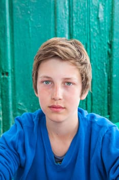 outdoor portrait of happy young teenage boy