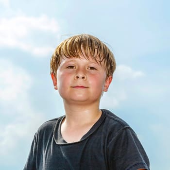 portrait of sweating boy after sport looks confident
