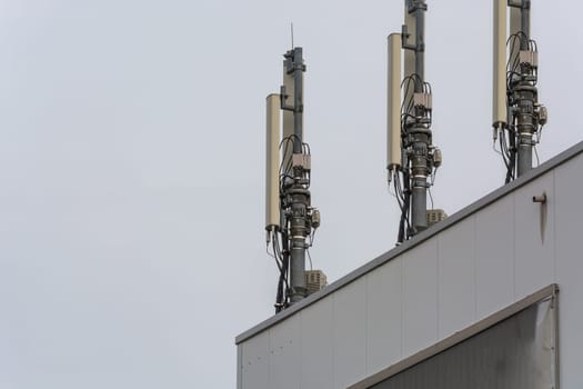 Antenna,telecommunications tower on a roof,wireless telecommunications concept..