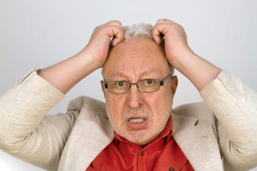 Senior in fear and panic on a bright background