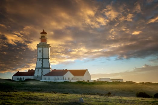 Beautiful Cabo Espichel lighthouse in Portugal, by sunset