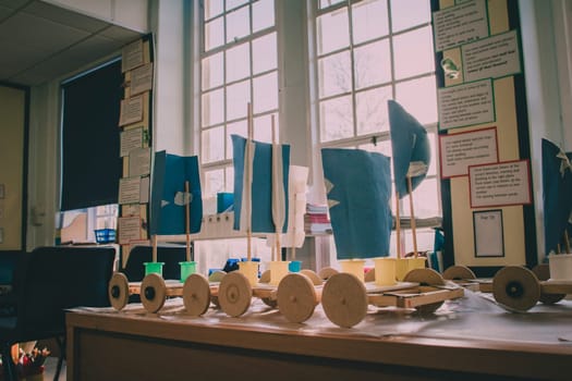 Primary school physics projects are on display in a classroom.