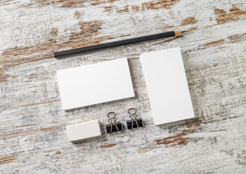 Blank stationery set. Mockup for your design. Responsive design template. Bank business cards, pencil, eraser, badge and sharpener. Top view.