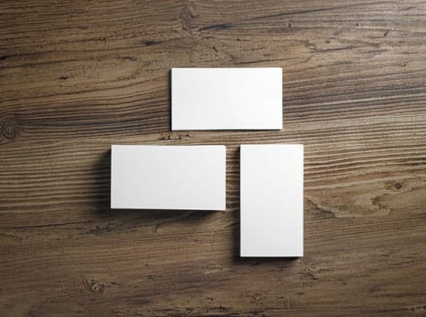 Piles of blank business cards on wood table background. Mock up for ID. Blank template for branding identity. Top view.