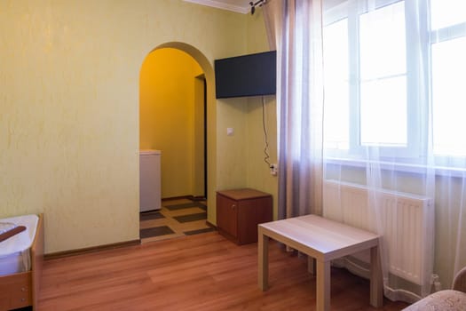 Entrance to the room and a window in the interior rooms of the guest house