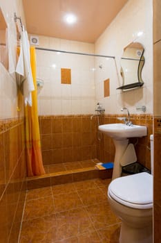 Bathroom combined with toilet in the hotel, general view