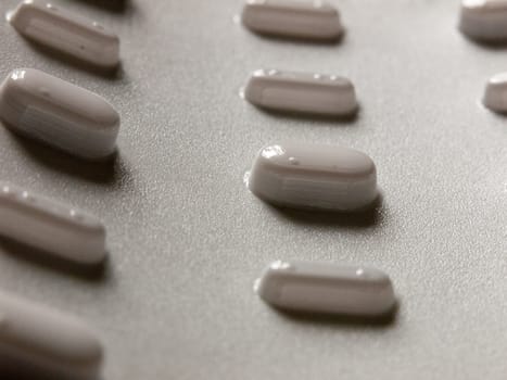 tablets in a packet upside down seen from bottom for illness relief studio