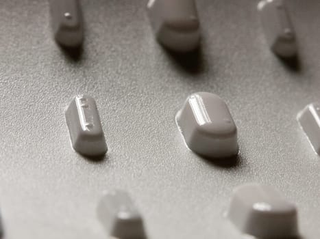 tablets in a packet upside down seen from bottom for illness relief studio