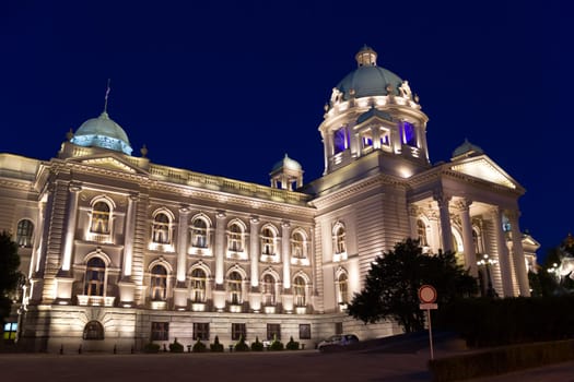 Parliament of Serbia (former Parliament of Yugoslavia) palace, also known as National Assembly of the Republic of Serbia, night scene, illuminated by decorative light. The building is situated in the centre of Belgrade on Nikola Pasic Square. It was damaged by fire during riots against Milosevic regime occurred on October 5th, 2000.