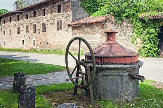 Old well covered with hand pump. It needed around the country.