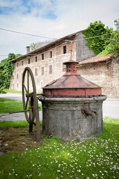 Old well covered with hand pump. It needed around the country.
