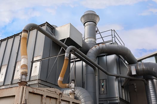Industrial factory air filtration system. Tubes, tank and chimney.