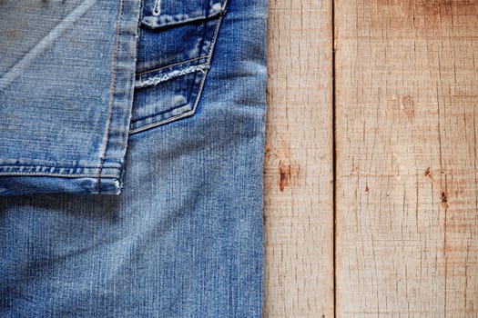 Blue jeans on the old wooden floor.