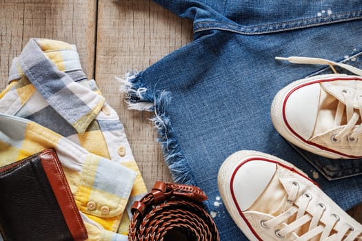Clothing and accessories on the old wooden floor.