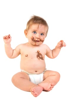 Beautiful baby boy covered in chocolate isolated in white background