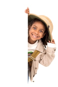 Young girl with Safari clothes behind a white board isolated in white