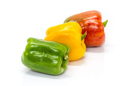 colored peppers over white background, Fresh vegetables sweet Peppers or Bell peppers