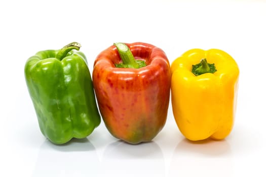 colored peppers over white background, Fresh vegetables sweet Peppers or Bell peppers