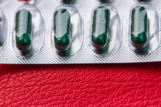 blur of pill and capsule of antibiotics in blister packaging
