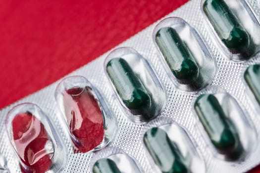 blur of pill and capsule of antibiotics in blister packaging