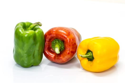 colored peppers over white background, Fresh vegetables sweet Peppers or Bell peppers