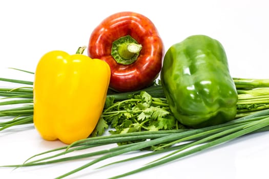 colored peppers over white background with Fresh vegetables