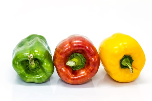 colored peppers over white background, Fresh vegetables sweet Peppers or Bell peppers
