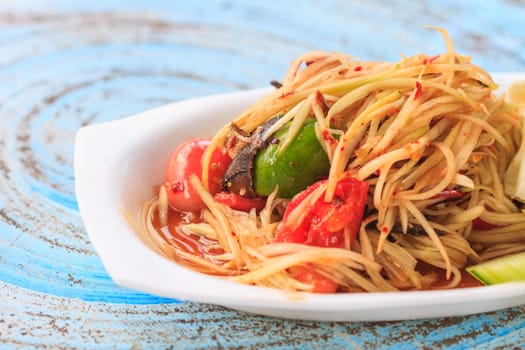 SOM-TAM, Thai delicious raw papaya salad with unique taste hot and spicy, this dish with tomato and crab.