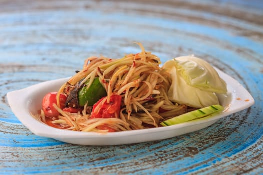 SOM-TAM, Thai delicious raw papaya salad with unique taste hot and spicy, this dish with tomato and crab.