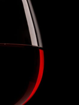 Wine glass with red wine, selective focus on small bubble using as an abstract beverage background with space for text