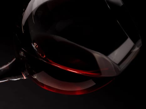 Glass of red wine on a dark background