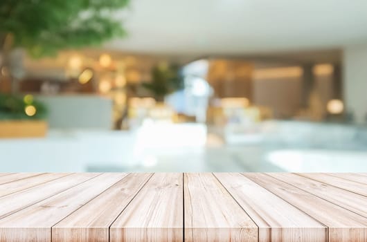 Empty wooden table top with blurred modern lobby background. can be used product display.