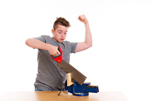 teenager in professional training using hand saw in front of white background