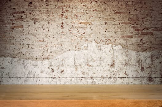 Empty wooden table top with old brick wall background. can be used product display.