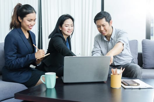 Success business team concept. Group of asian peoples dicussing something while working in office.