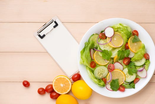 Menu, food recipe, paper and homemade fresh salad.