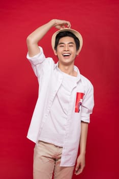 Portrait of elegant young handsome asian man with hat. Cool fashion male model.