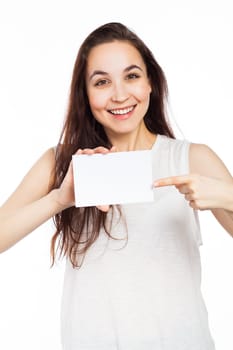 Cheerful woman showing a blank signboard, isolated on white