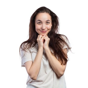 Portrait of a pretty young woman looking at the camera, isolated on white