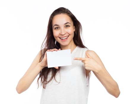 Young woman showing a white signboard, isolated on white