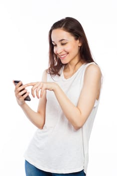 Young woman writing on her phone, isolated on white