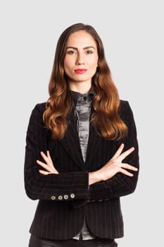 Portrait of a businesswoman, on grey background
