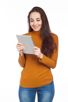 Young woman reading on an electronic tablet, isolated on white