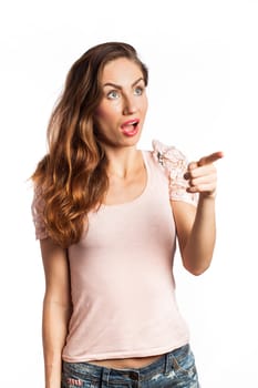 Portrait of a surprised woman pointing at the copy space, isolated on white