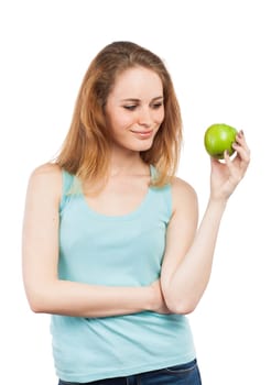 Portrait of a beautiful girl holding a green apple, isolated on white