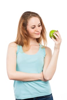 Portrait of a beautiful girl holding a green apple, isolated on white