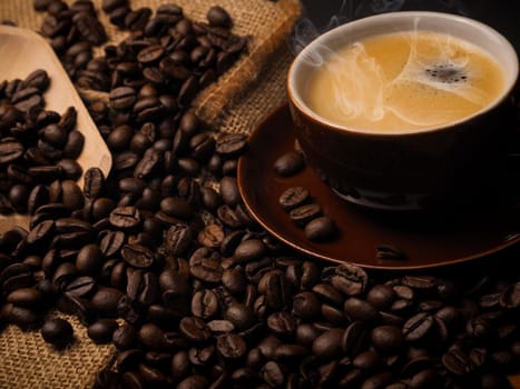 Cup of espresso with espresso beans close up shot