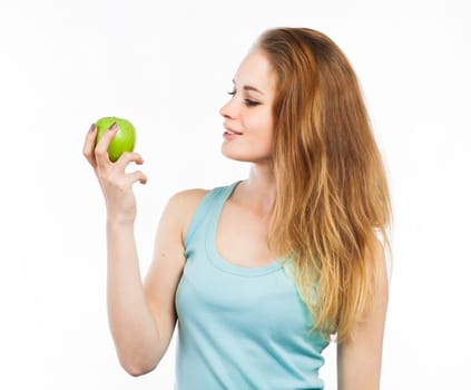 Portrait of a beautiful girl holding a green apple, isolated on white